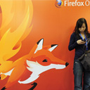 Woman on her cellphone in front of a Firefox advertisement